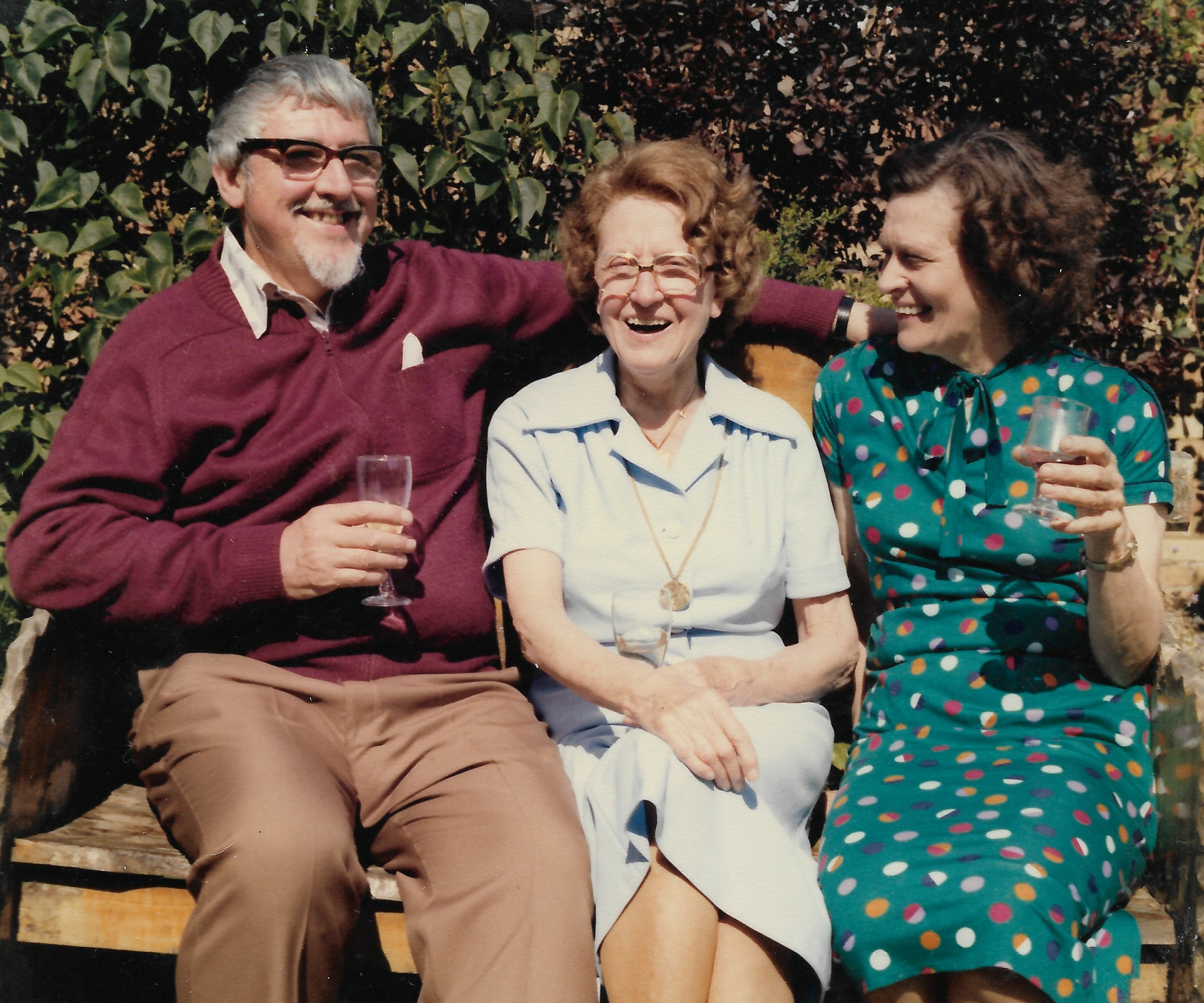 Leonard Salzedo drinking champagne with his mother and wife in the garden